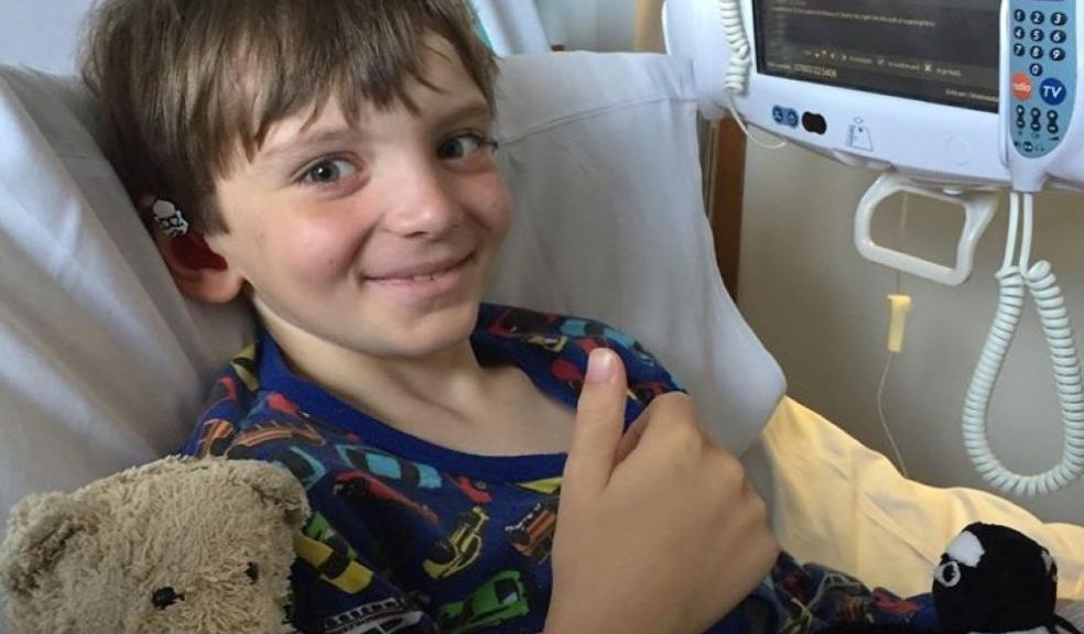 A patient gives the donation a thumbs up
