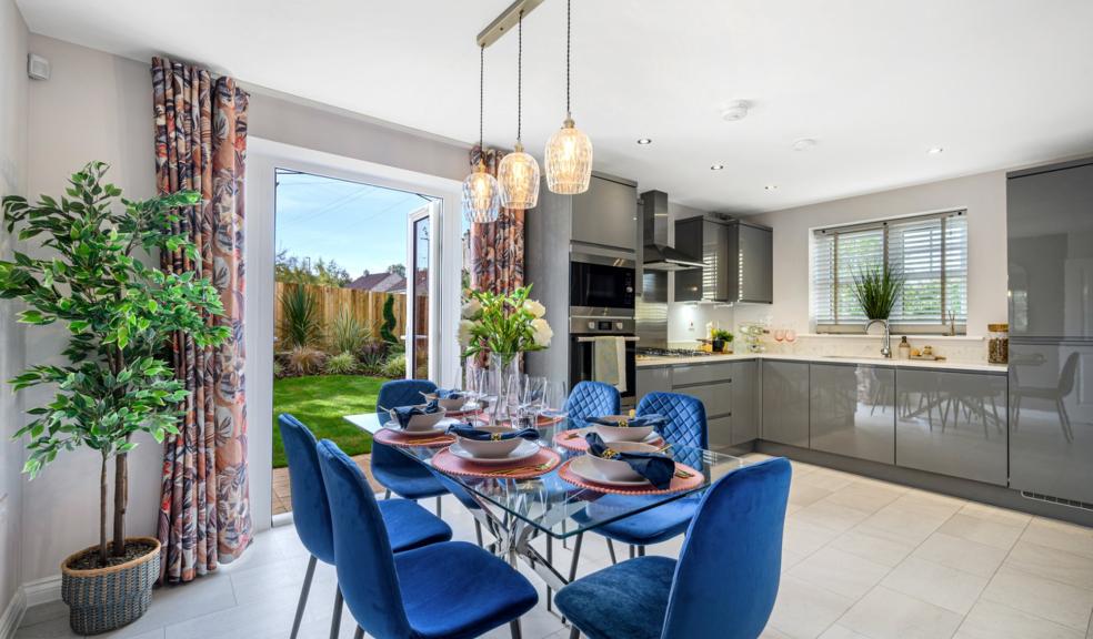 The open plan kitchen and dining room in the Elan show home at Avalon, Glastonbury, opens out onto the garden