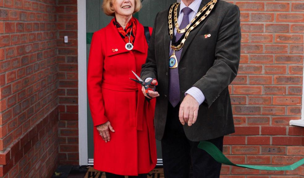 .The Mayor and Mayoress of St Asaph Cllr Colin and Gwenda Hardie cut the ribbon to officially open the Castle Green show homes at Maes yr Haul