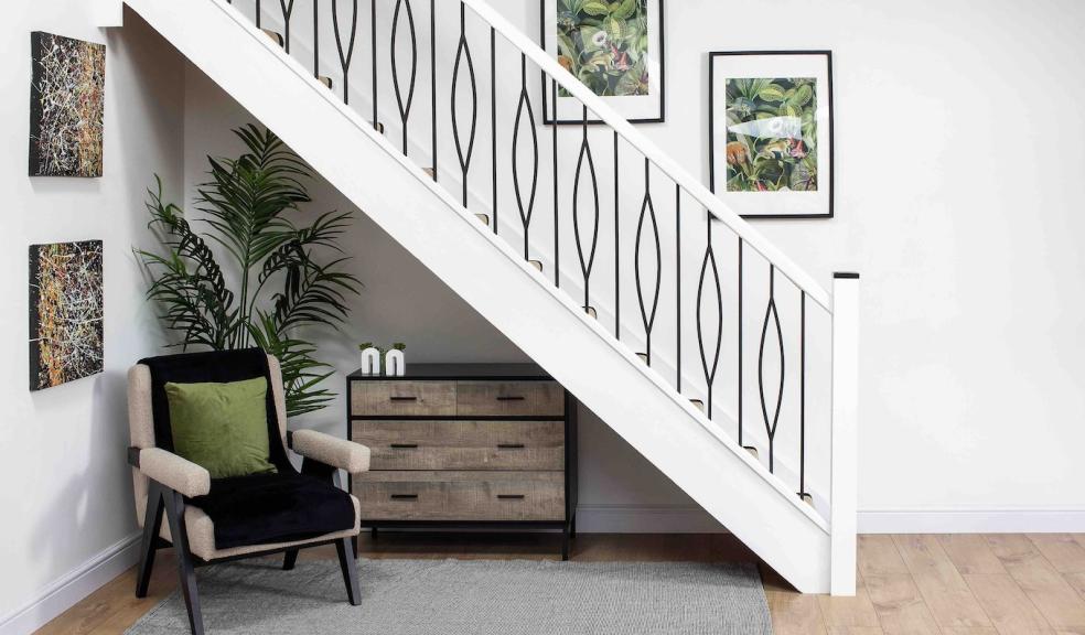 White staircase with black metal spindles White staircase with black metal spindles