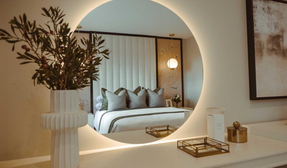 Styled by Lifestyle Interiors, the main bedroom in the Cheltenham show home at Castle Green’s Bridgewater View development in Daresbury in a divan base and headboard, plus flower arrangement from Rowen Homes
