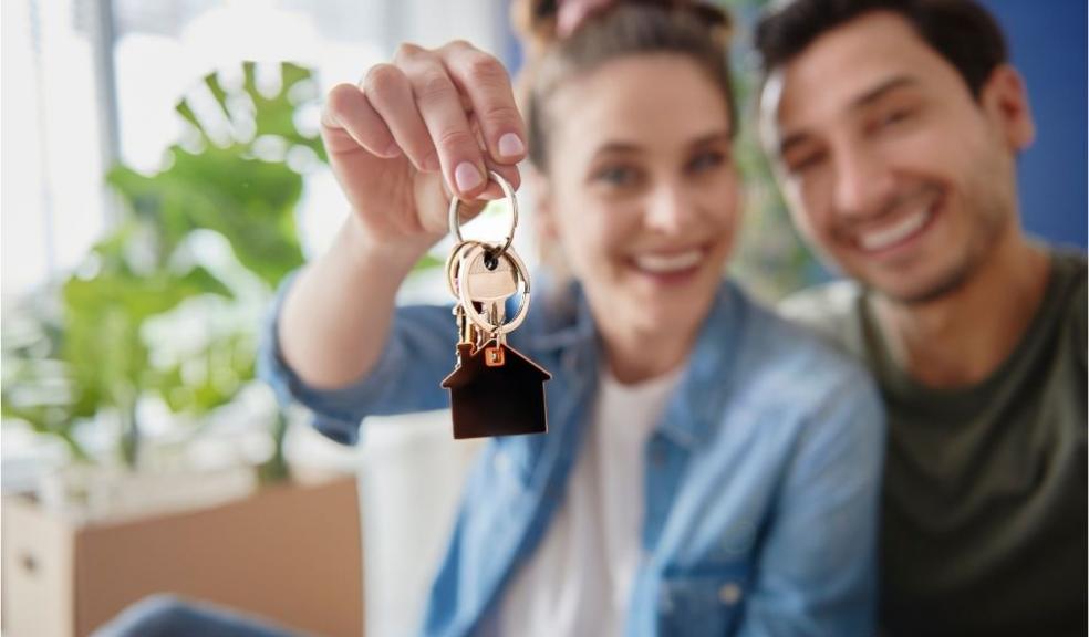 Young Couple with Keys of their New House Young Couple with Keys of their New House