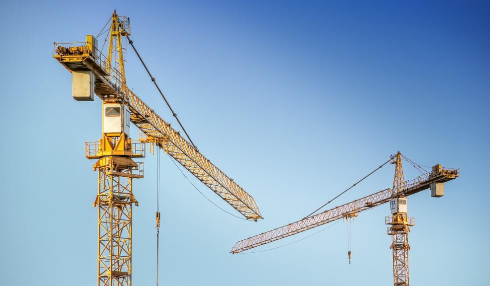 A pair of cranes on a construction site