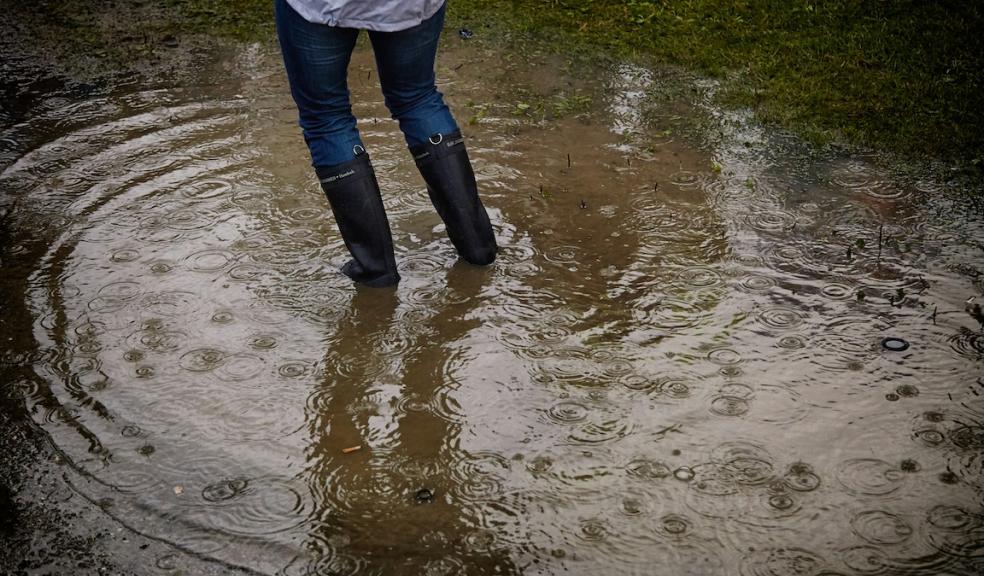 Woman stood in flood water Flooding