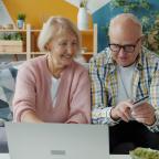 Couple calculating household bills Couple calculating household bills