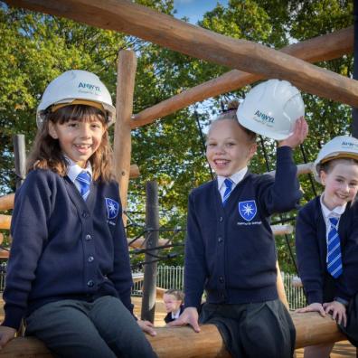 Children from Handforth Grange Primary School try out the new play area in Handforth