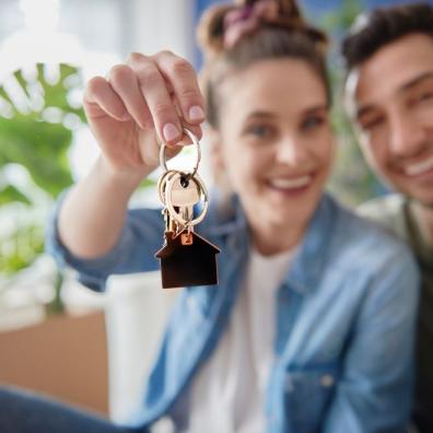 Young Couple with Keys of their New House